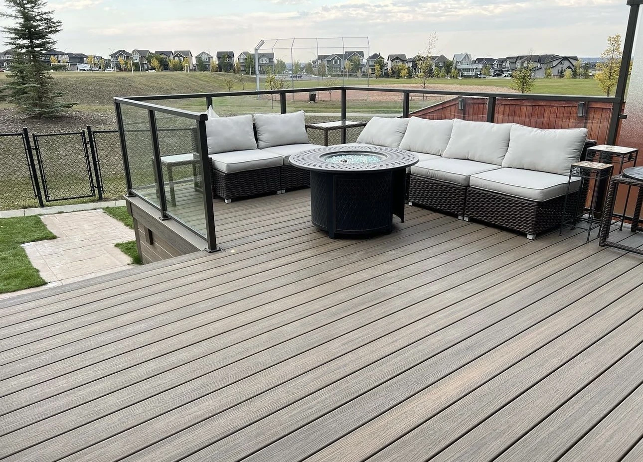 Composite deck with glass metal railing